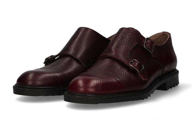 Two burgundy buckles crest