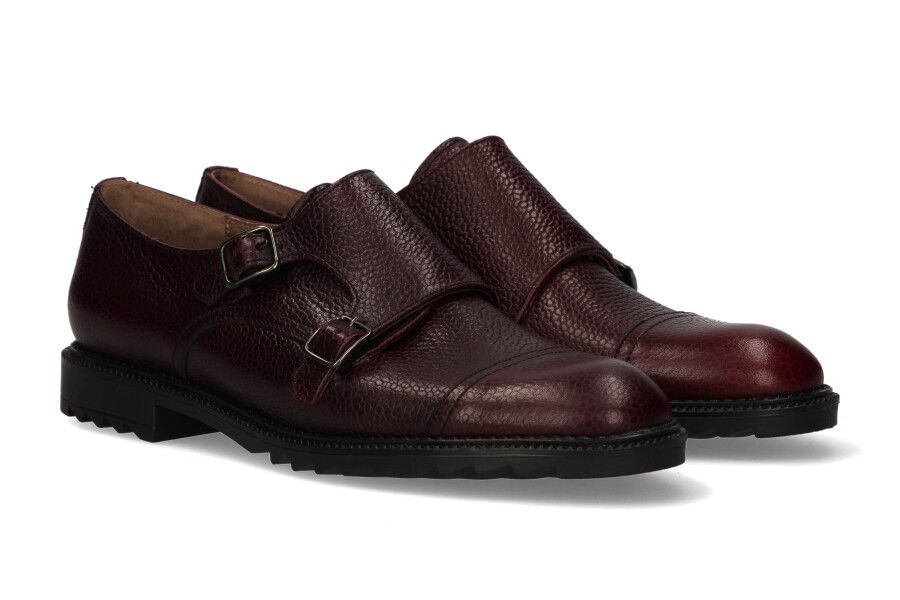 Two burgundy buckles crest