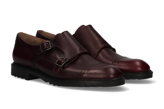 Two burgundy buckles crest