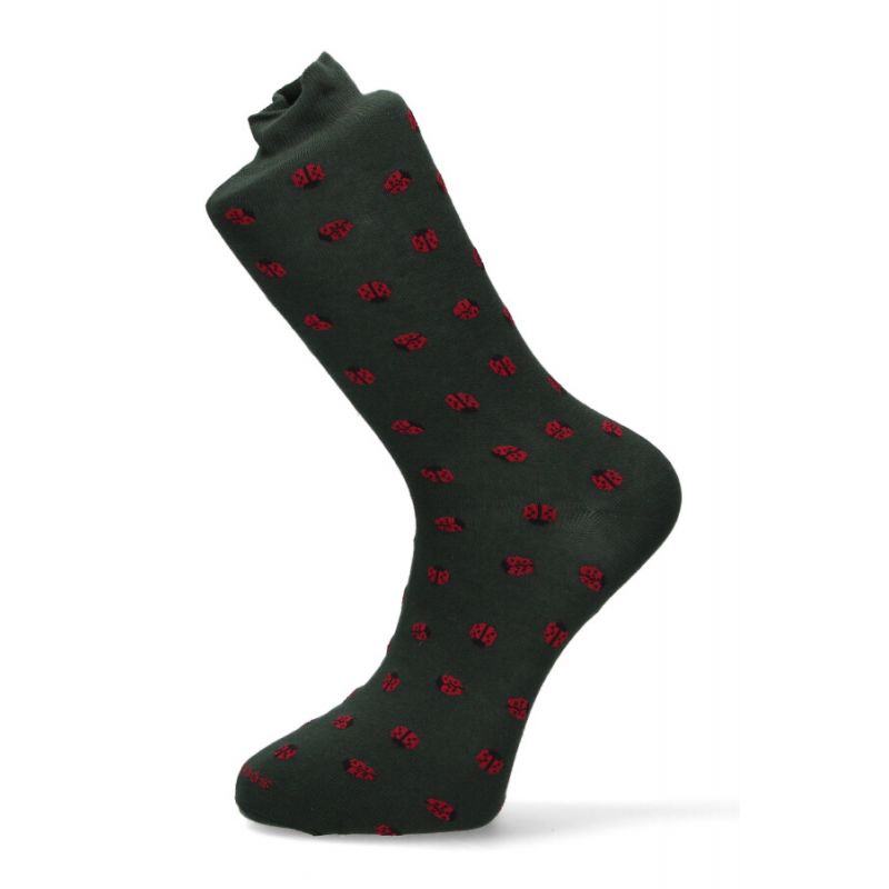 Green sock with ladybird pattern